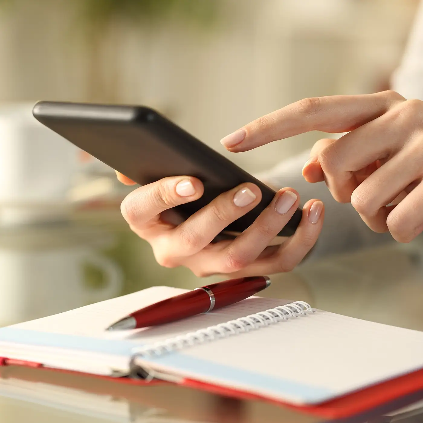 Woman booking urgent delivery with TM Courier Services